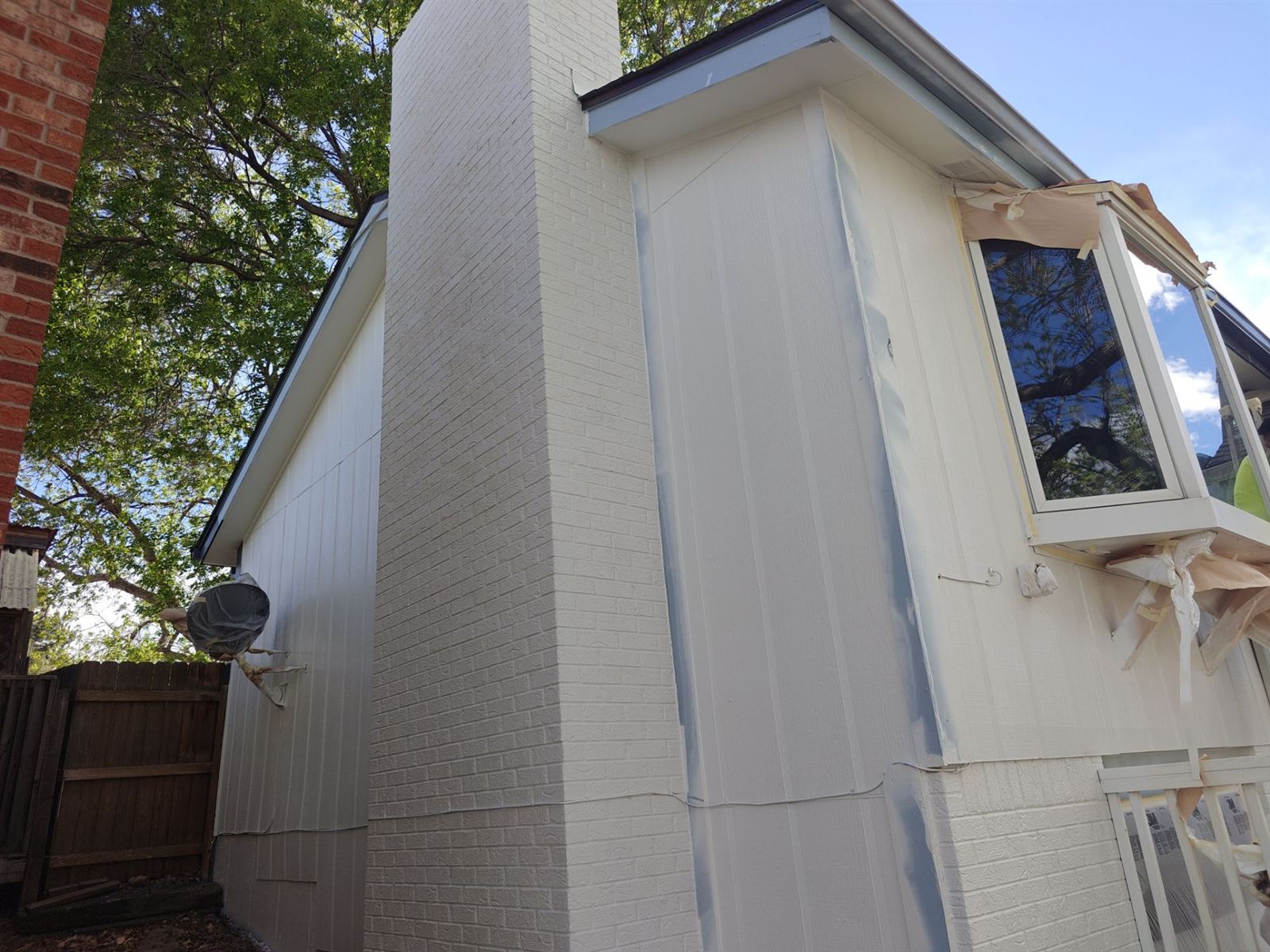 Exterior home painting with contrasting accent trim color near Wheat Ridge, Colorado